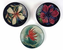 Three Moorcroft pin dishes - including two by Sian Leeper