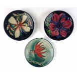 Three Moorcroft pin dishes - including two by Sian Leeper