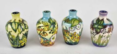 A Moorcroft trial set of four 'The Seasons' vases designed by DJ Hancock