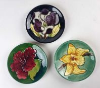 Three Moorcroft pin dishes including Hibiscus