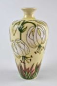 A Moorcroft vase designed by Rachel Bishop, decorated with white lilies, dated 2000, numbered '