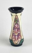 A Moorcroft 'Foxglove' vase designed by Rachel Bishop, dated 1999, signed in gold by J. Moorcroft,