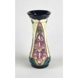 A Moorcroft 'Foxglove' vase designed by Rachel Bishop, dated 1999, signed in gold by J. Moorcroft,