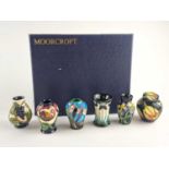 A set of six Moorcroft miniature vases, in fitted case.