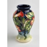 A small Moorcroft vase in the Hummingbird pattern designed by Anji Davenport