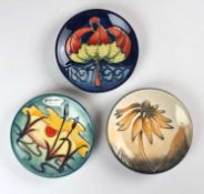 Three Moorcroft pin dishes including Coneflower