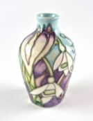 A miniature Moorcroft vase decorated with snowdrops