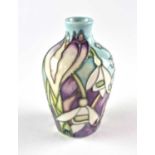 A miniature Moorcroft vase decorated with snowdrops