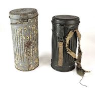 Two German Third Reich gas mask respirator tins and a German civilian VM40 respirator