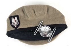 A post-war SAS Other Ranks beret, size 57, together with SAS stable belt buckle