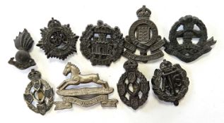 Nine WW2 British economy bakelite badges