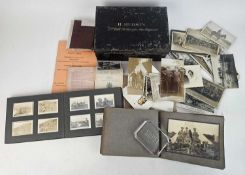 Two military photograph albums, military postcards and other items