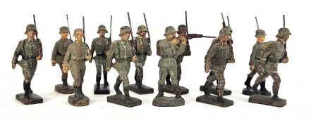 Twelve German painted composition toy models of WW2 German soldiers, predominantly Elastolin and