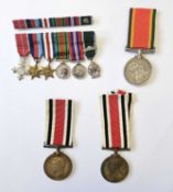 A small mixed group of medals. Two Faithful Service in the Special Constabulary Medals to "Edwin