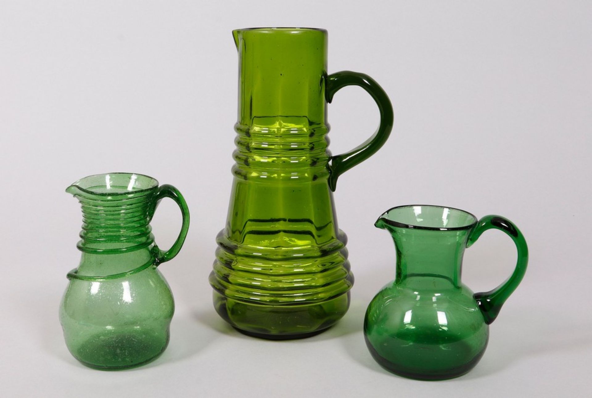 Mixed lot of glass jugs in green, 3 pieces, German/Bohemian, 19th/20th C.