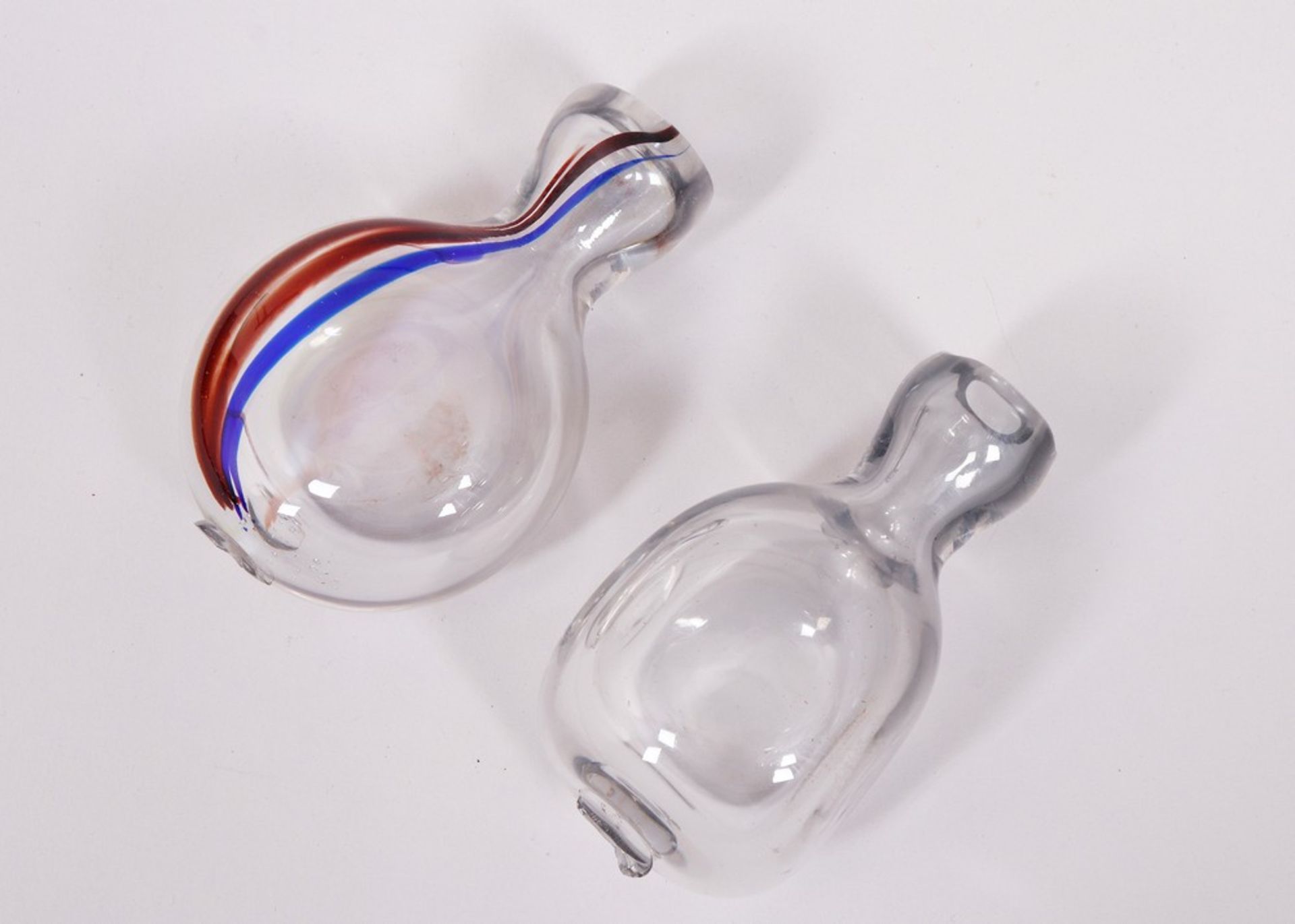 A pair of snuff bottles, so-called "Bixl", transparent snuff bottles with colored inclusions, South