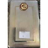 Automobile interest: A chrome MG enamel badged cigarette case, made in England by Kingcraft. In very