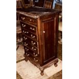 A 20th Century mahogany chest of drawers, in the style of a wellington chest, the drawers arranged