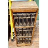 A 20th century oak bookcase, three tier shelves; 15 books illustration of Charles Dickens stories (
