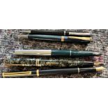 Three fountain pens and two mechanical pencils, comprising a Messenger black and gold coloured