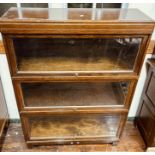 A 20th century oak glazed Globe Wernicke bookcase, circa 1947, three tier and makers name on the