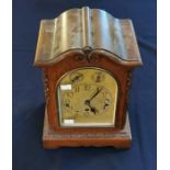 An early 20th century oak cased bracket clock with chime switch. 39cm high, 26cm wide, 18cm deep.