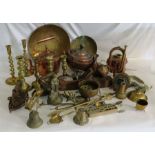 A large collection of copper and brass, to include brass candlesticks, copper kettle, flat irons,