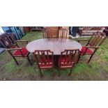 An early 20th century mahogany dining room table and chairs.