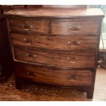 A George III mahogany bow front chest of drawers, circa 1800, slight over-sailing top, above two