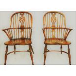 A pair of elm and ash Windsor chairs, high hoop spindle back with pierced splat, shepherd crook