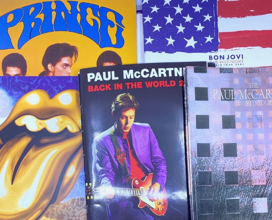 A collection of concert programmes, 1980s to 2000s, including Prince, Rolling Stones, Paul