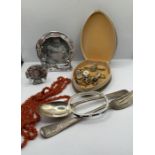 A selection of jewellery and collectables comprising two silver plated pewter photo frames, a coral