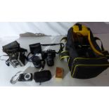 A camera bag full of camera and lenses, to include a Coronet roll film colour filter camera,