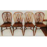 A set of four elm and ash Windsor dining chairs; another wheel back chairs. (5)