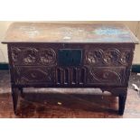 A Charles II and later oak blanket chest, single plank moulded edge hinge lid, foliage and arch