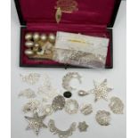 A selection of antique mother of pearl jewellery frames in a small case.