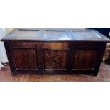 An 18th Century oak coffer, three moulded ring hinged lid, enclosing interior candle drawers,