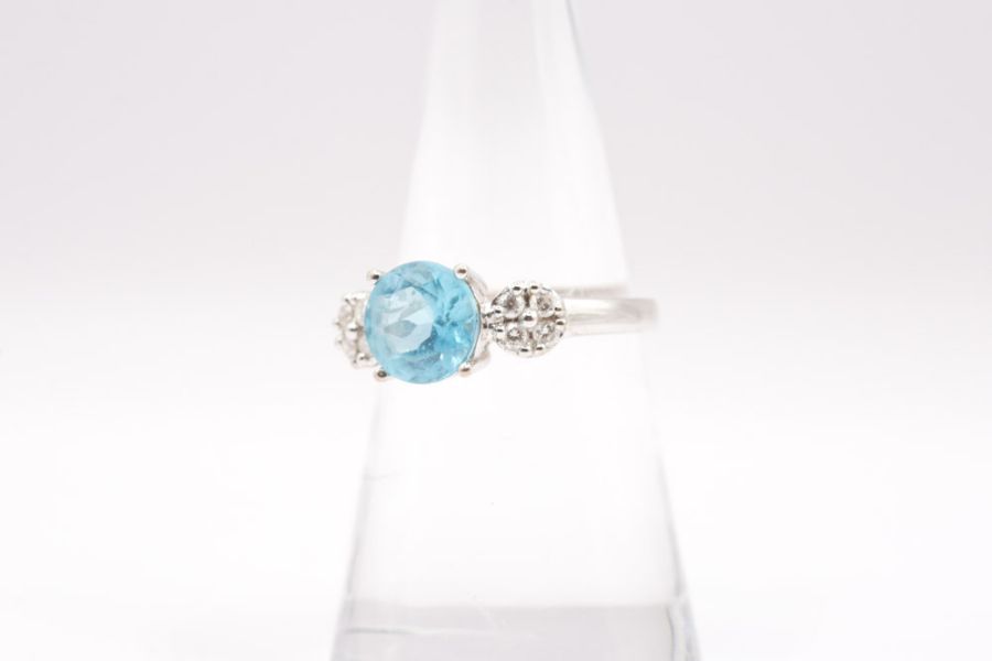 An electric blue Apatite and diamond dress ring in 18ct gold. Hallmarked for Birmingham and with