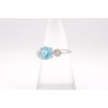 An electric blue Apatite and diamond dress ring in 18ct gold. Hallmarked for Birmingham and with