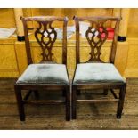 A pair of George III elm dining chairs, in a Thomas Chippendale manner, urn cresting splat,