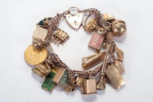 A 9ct rose gold bracelet with a padlock clasp, used as a charm bracelet and featuring 22 charms,