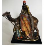 An Austrian cold painted spelter table lighter in the style of Bergman, cast as two carpet sellers
