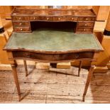A late Victorian walnut writing table, circa 1900, three quarter gallery top, above on