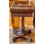 A William IV mahogany teapoy, circa 1830, the sarcophagus shaped top enclosing four later tea