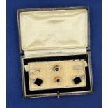 A set of Art Deco platinum and 9ct gold dress studs and cufflinks in an octagonal geometric shape,