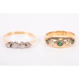 An Edwardian gypsy set 18ct gold ring featuring green and white stones, along with an early 20th