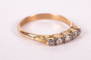 A five stone diamond set half hoop ring in yellow metal without marks. Gross weight approximately