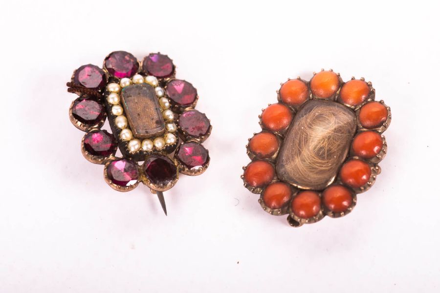 A pair of early 19th century yellow metal sentimental hair brooches - one is set with 12 coral