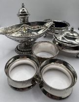 A selection of table silver comprising a part cruet set with salt, mustard and pepper pot; three