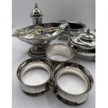 A selection of table silver comprising a part cruet set with salt, mustard and pepper pot; three